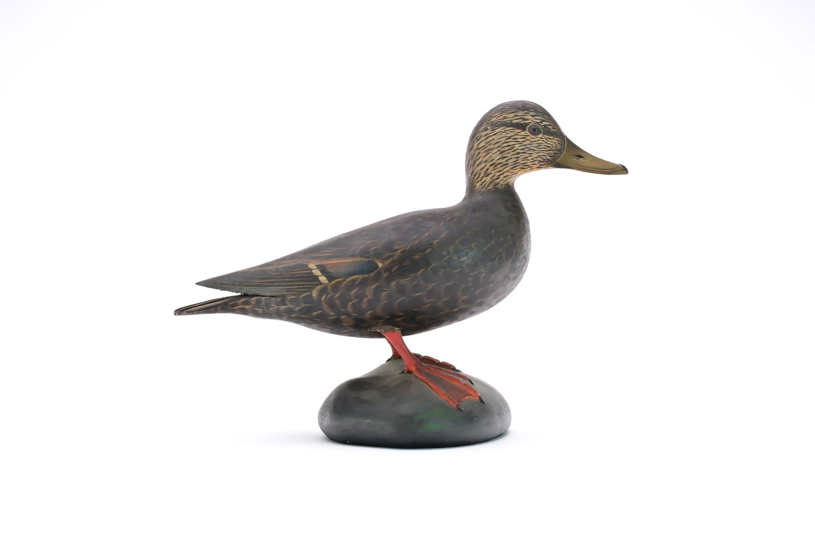 A. Elmer Crowell (1862-1952), East Harwich, Massachusetts.: Very rare half size standing decorative black duck. Slightly turned head and raised wingtips. Maker's oval brand in underside. Measures 11" long, stands 7.75" tall. Provenance: Dean Hyde collection.
