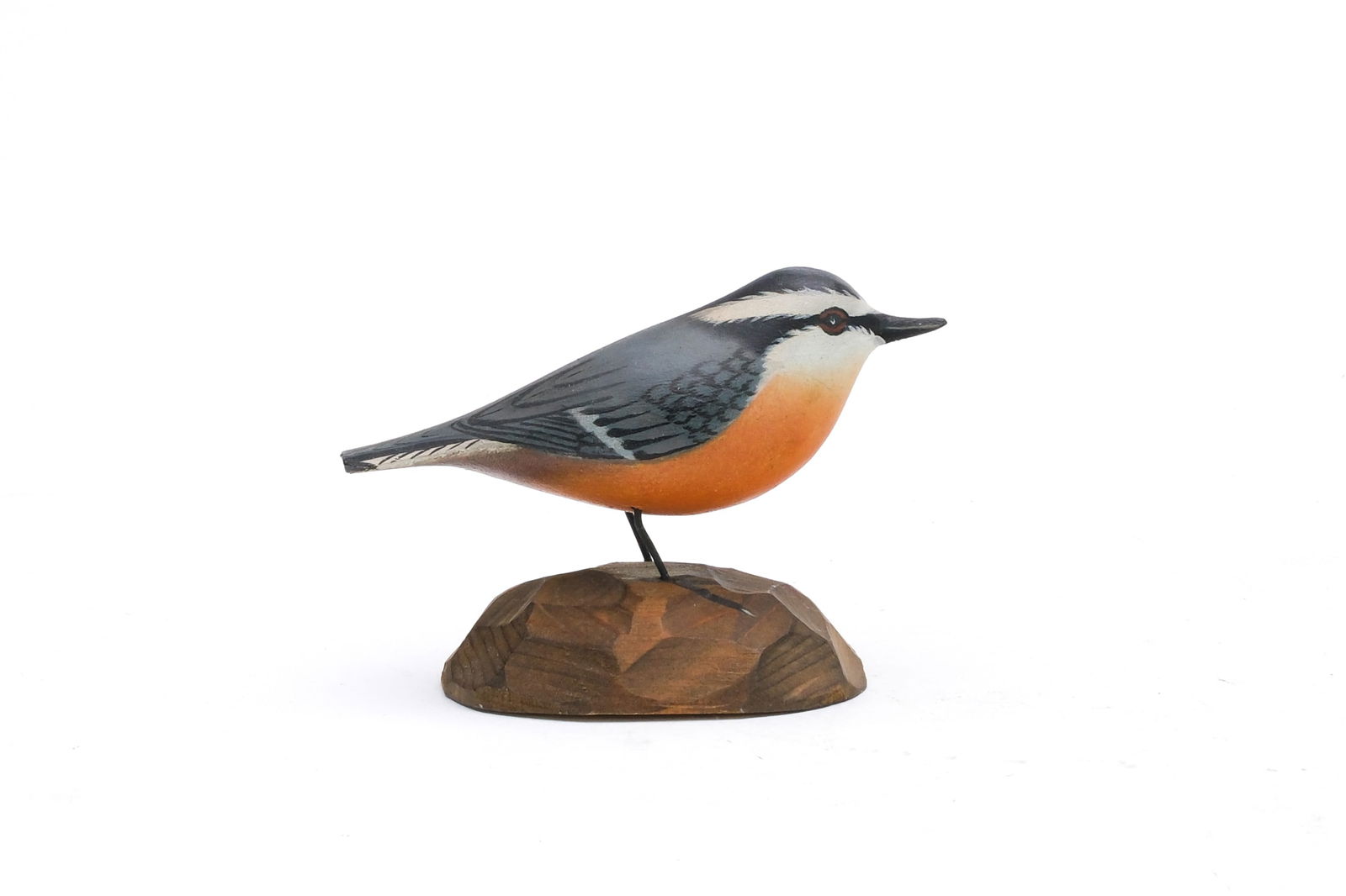 A. Elmer Crowell (1862-1951), East Harwich, Massachusetts.: Full size decorative nut hatch. On chip carved base with maker's rectangle stamp. Signed "Dad Crowell December 25, 1950". Measures 4" long. Provenance: Ted and Judy Harmon collection.