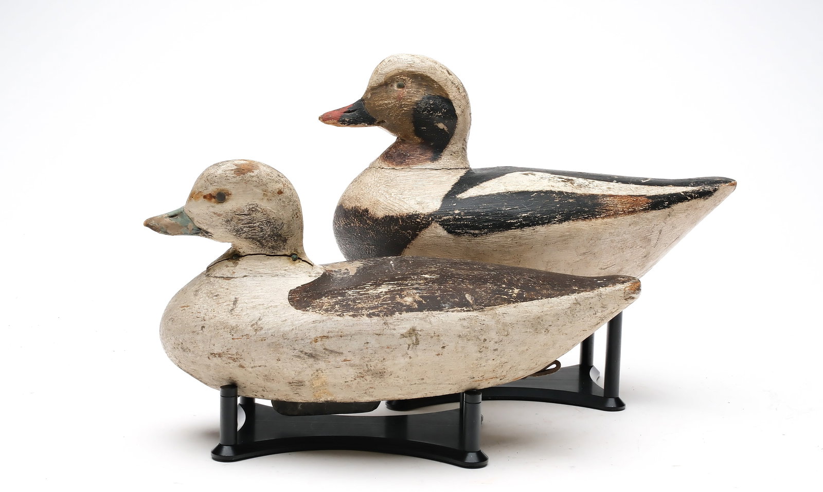 Edgar Allen Thompson, Cape Cod, Massachusetts.: Pair of long-tailed ducks. Tack eyes. Thompson brand on underside of hen. Measure 10.5" long. Provenance: Private Southern collection.