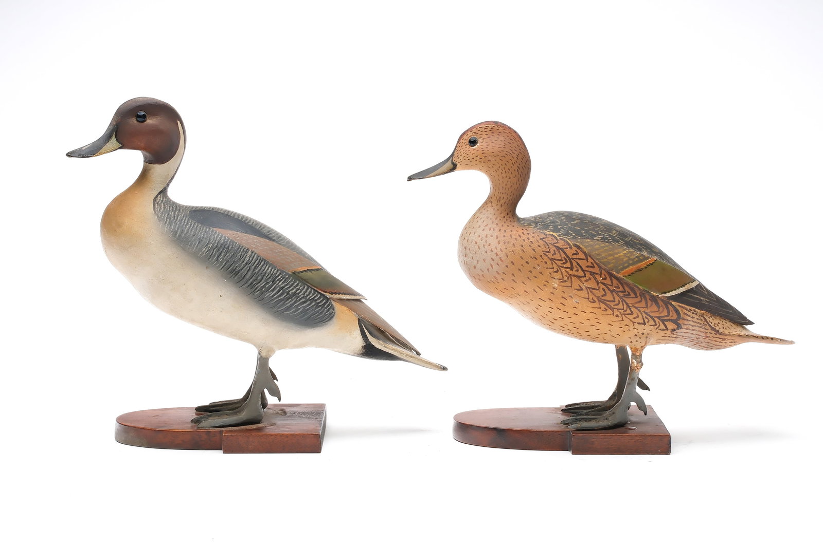 Ward Brothers, Crisfield, Maryland.: Pair of 2/3 size standing pintails. Balsa bodies with applied peach basket stave wingtips. Slightly turned heads. Hen is signed and dated 1948 under tail. Measure 11.75" long.
