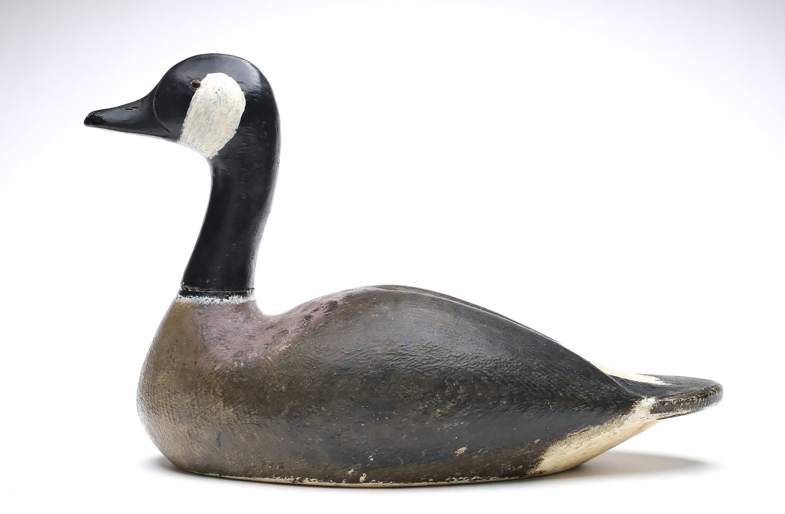 Amiel Garbaldi (1908-1993), Sacramento, California.: Rare Canada goose. Hollowed from the underside. Slight relief wing carving. Maker's name and 1932 on the inside of body. Measures 20.5" long.