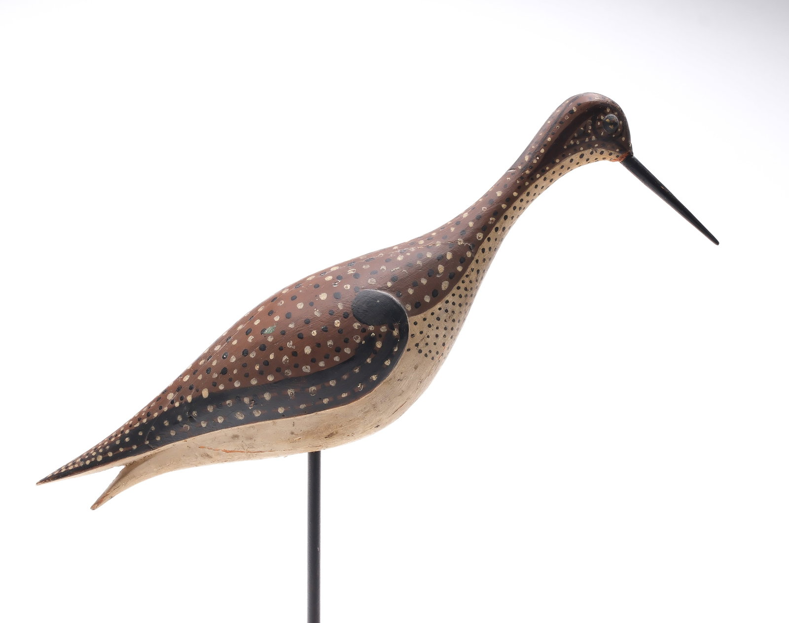 Unknown maker, Massachusetts, early 20th century.: Greater yellowlegs in alert pose. Three piece laminate body with deep relief wing carving and brass tack eyes. Very appealing polka dot paint pattern. Measures 13.5" long. Provenance: Martin and