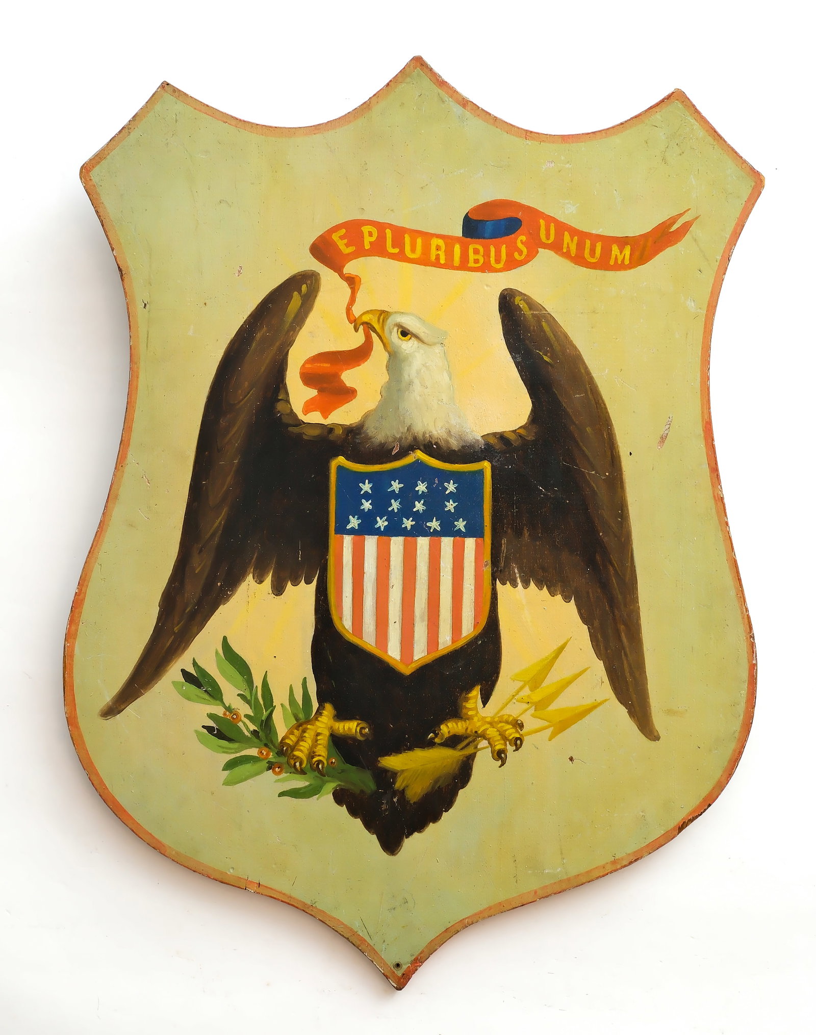 Excellent painted patriotic shield, late 19th century.: Bald eagle holding arrows and olive branches with banneret reading "E. Pluribus Unum". Stencil on back reads "B. Fabor decorator 931 and 933 B'Way Brooklyn". Metal pieces added to backside of pla