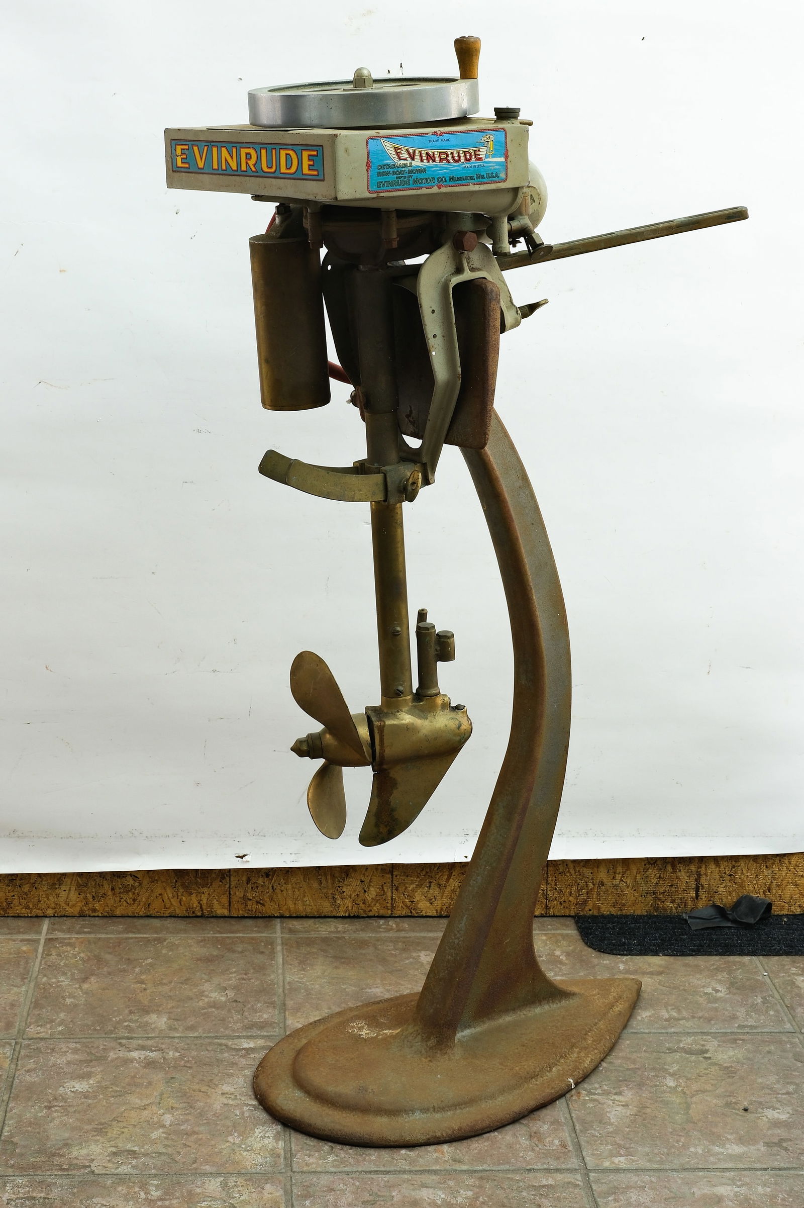 Evinrude Outboard Motor Company, Milwaukee, Wisconsin.: Brass tag reads reads "Evinrude Motor Co., Milwaukee, Wis., U.S.A. , Patented in U.S.A., Aug. 12, 1911, Dec. 11, 1911, and principal foreign countries, other patents pending, Model 13, 15426". Retains