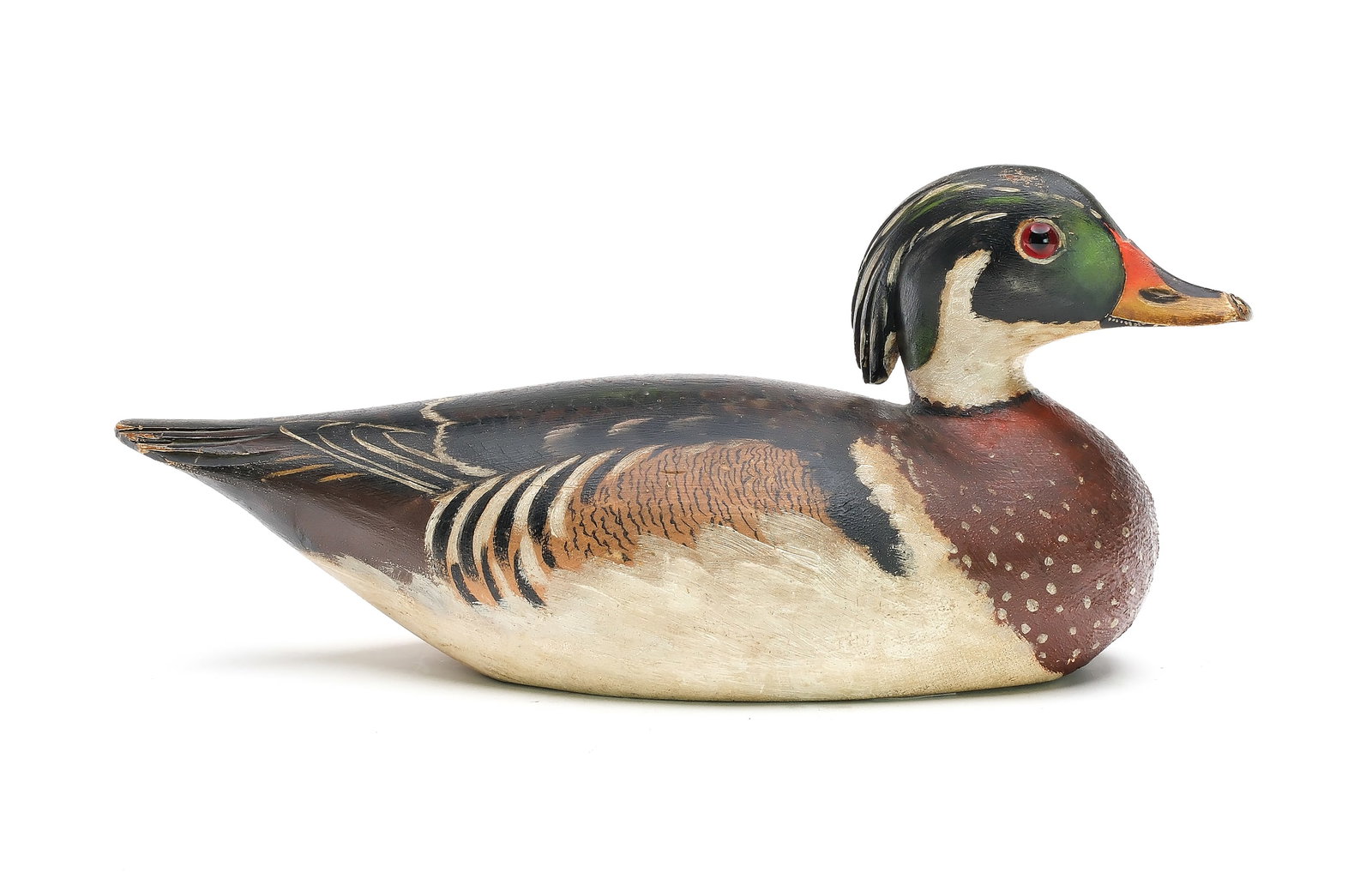A. Elmer Crowell (1862-1952), East Harwich, Massachusetts.: Excellent wood duck. Slightly turned head with relief tail feather carving. Extended crest has relief feather carving. Maker’s oval brand in underside. Measures 13.5” long. Provenance: Ton