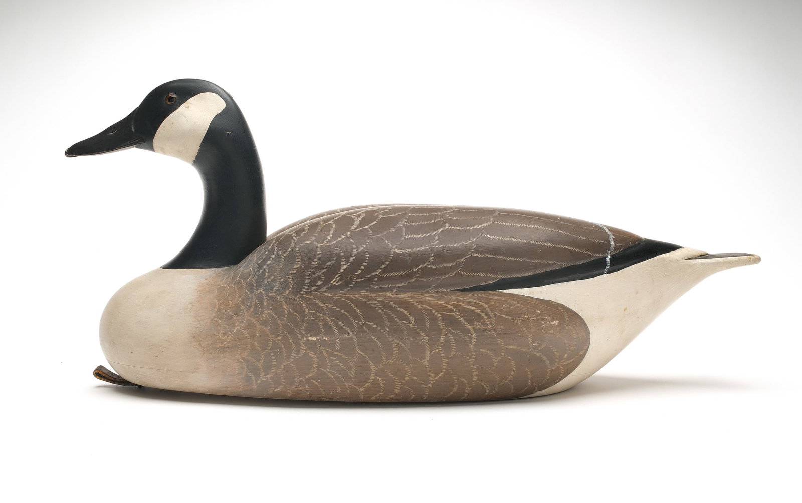 Charles E. "Shang" Wheeler (1872-1949), Stratford, Connecticut.: Rare and important Canada goose. Hollow carved with relief wing and highly detailed bill carving. Measures 26” long. Provenance: Estate of the maker. Connecticut Audubon Society collection. Jim 