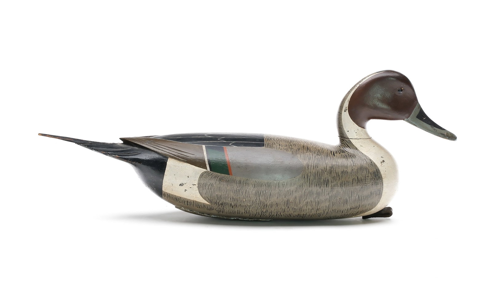 John English (1848-1915), Florence, New Jersey.: Exceedingly rare English/Dawson pintail. One of only two known. Hollow carved with raised neck seat and raised V wingtip carving. Relief tail feather carving and inlaid hardwood tail sprig. Hillman co