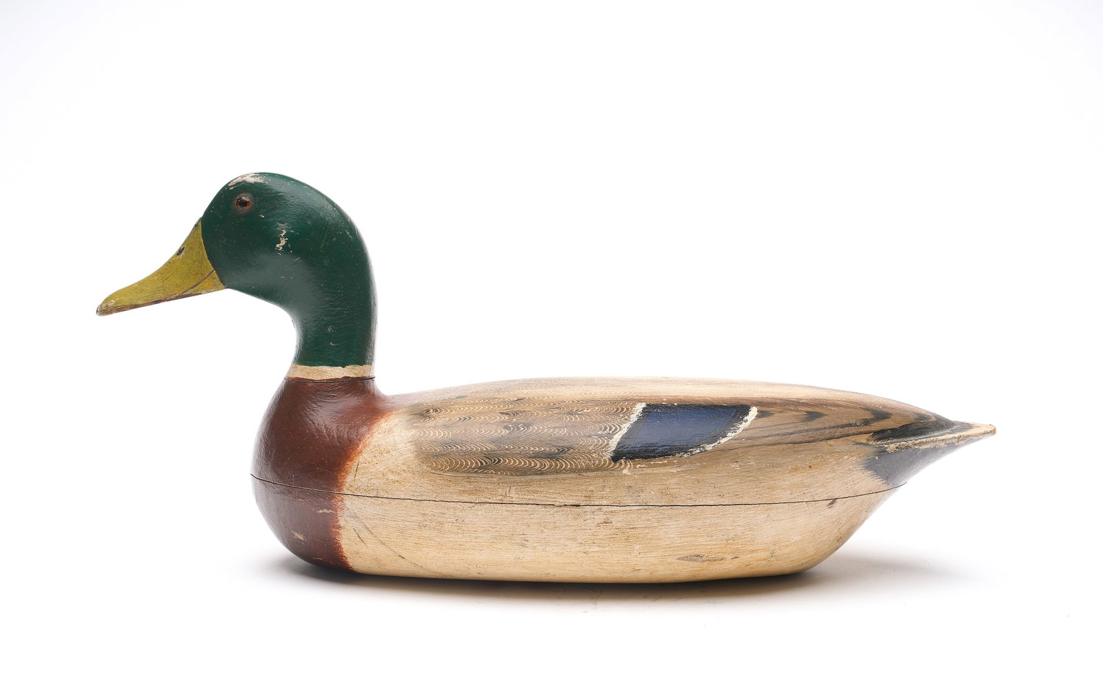 Charles Walker (1873-1954), Princeton, Illinois.: Rare mallard. Hollow carved with comb feather paint detail on back. “34” painted on underside for the Watson Lawton rig. Also stamped “Ed Moore.” Measures 17” long. Prove