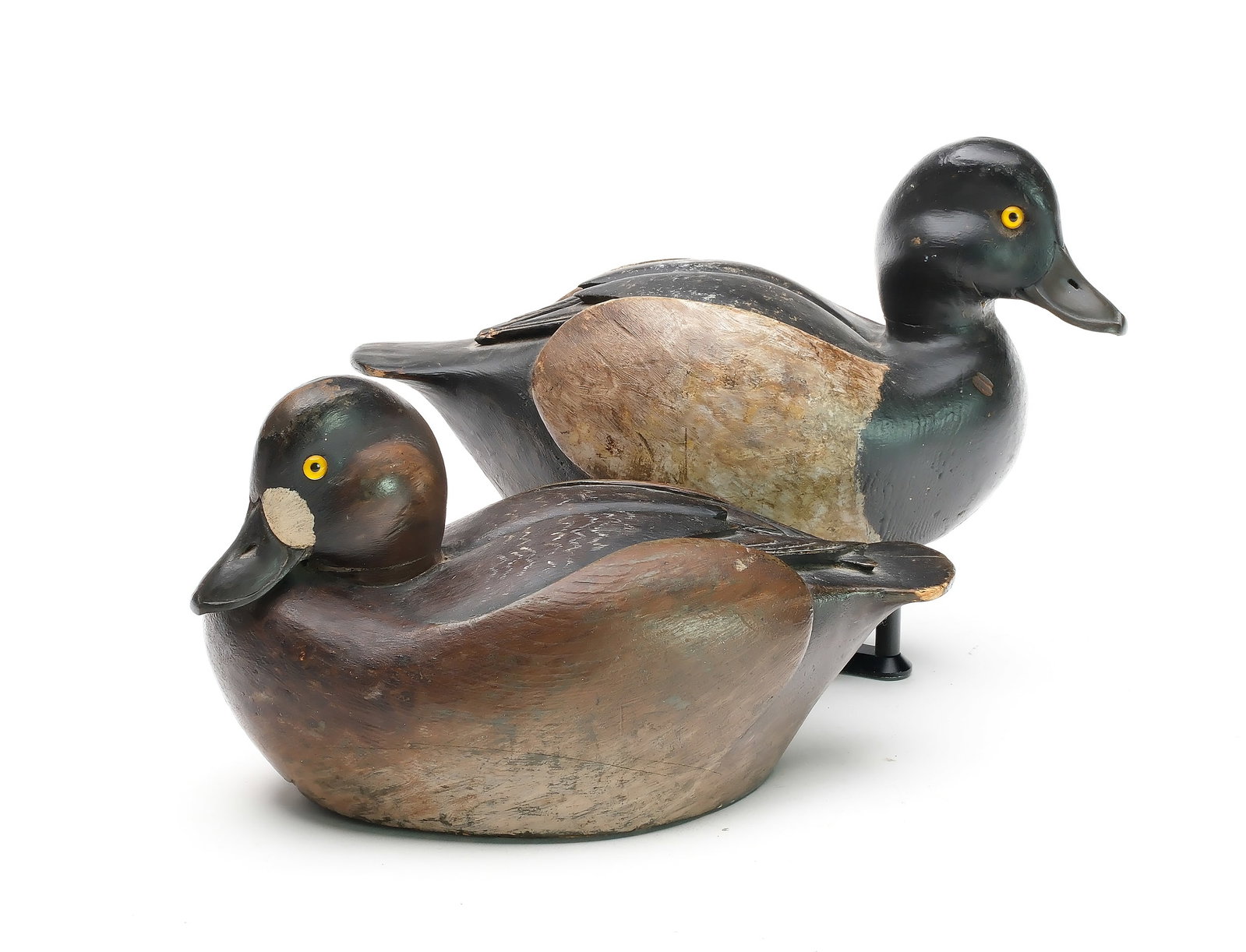 Warren Dettman (1904-1979), Milwaukee, Wisconsin.: Rigmate pair of bluebills. Relief wing carving and raised wingtips. Hen with tucked head. Both with slightly turned heads. Hen with “L VI” carved in underside, drake with “L VII̶