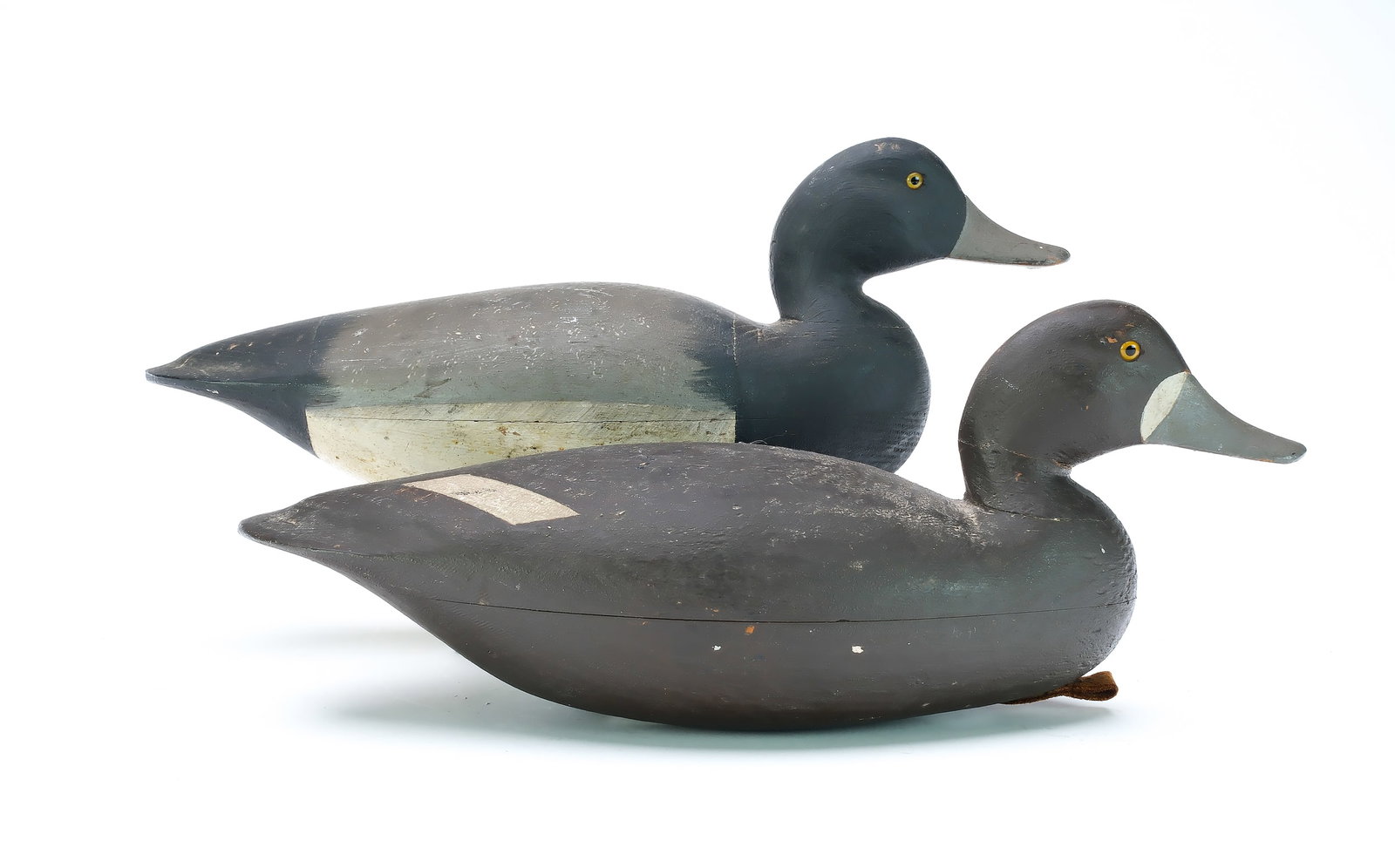 Stanley Grant (1877 - 1953), Barnegat, New Jersey.: Rigmate pair of bluebills. Hollow carved with inlaid lead weights. Maker’s initials stamped in lead weights. Measure 15” long. Provenance: Jim and Diane Cook collection.
