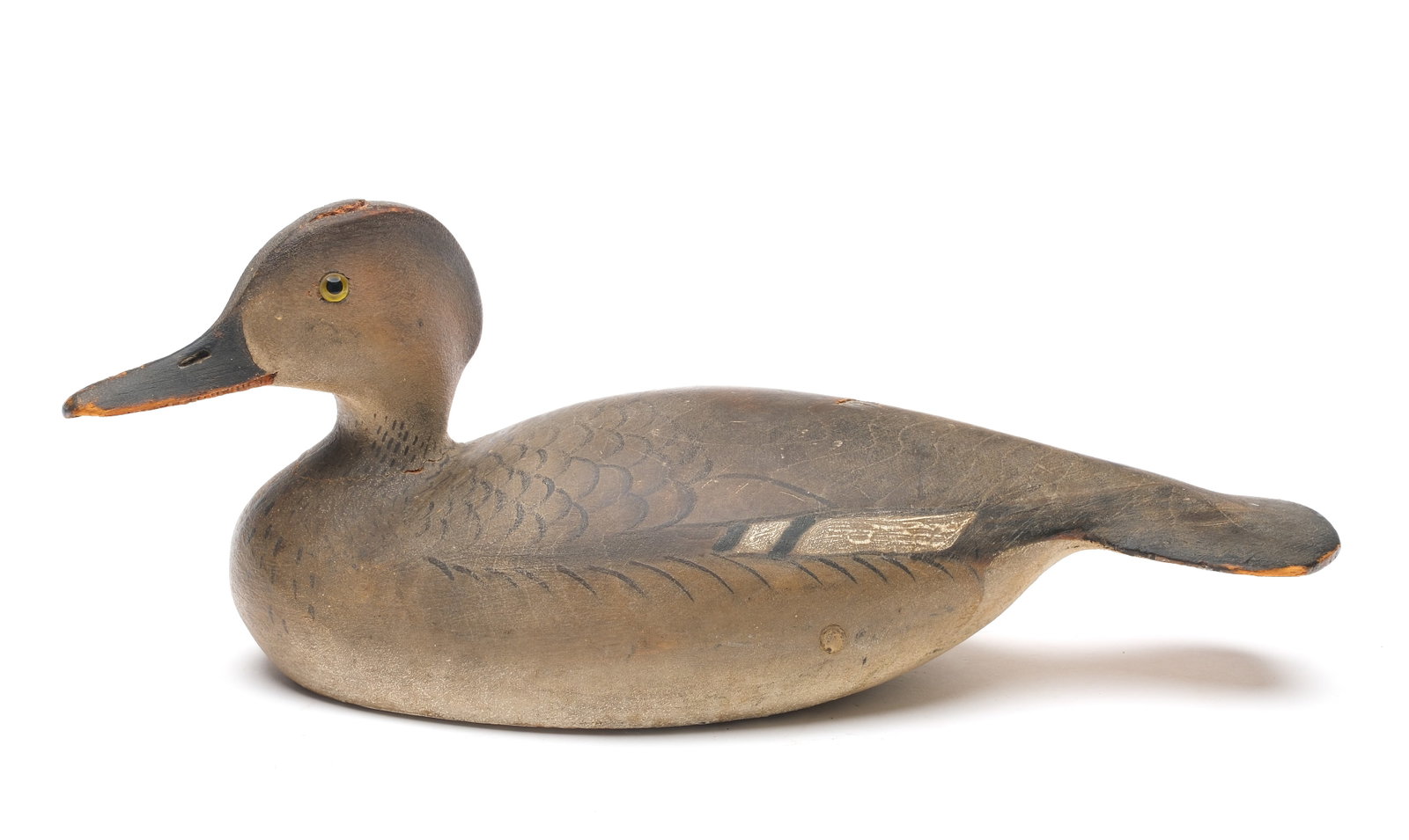 Ward Brothers, Crisfield, Maryland.: Exceedingly rare hooded merganser hen. 1936 style with slightly turned head, extended crest, and wide tail carving. Maker's ink stamp on underside. Also identified and inscribed "Made for John H. Moor