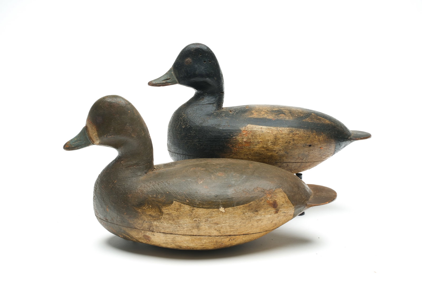 Ira Hudson (1873-1949), Chincoteague, Virginia.: Rigmate pair of bluebills. Hollow carved with raised neck seats and tack eyes. Measure 12.5" long. Provenance: Oliver Smith collection.