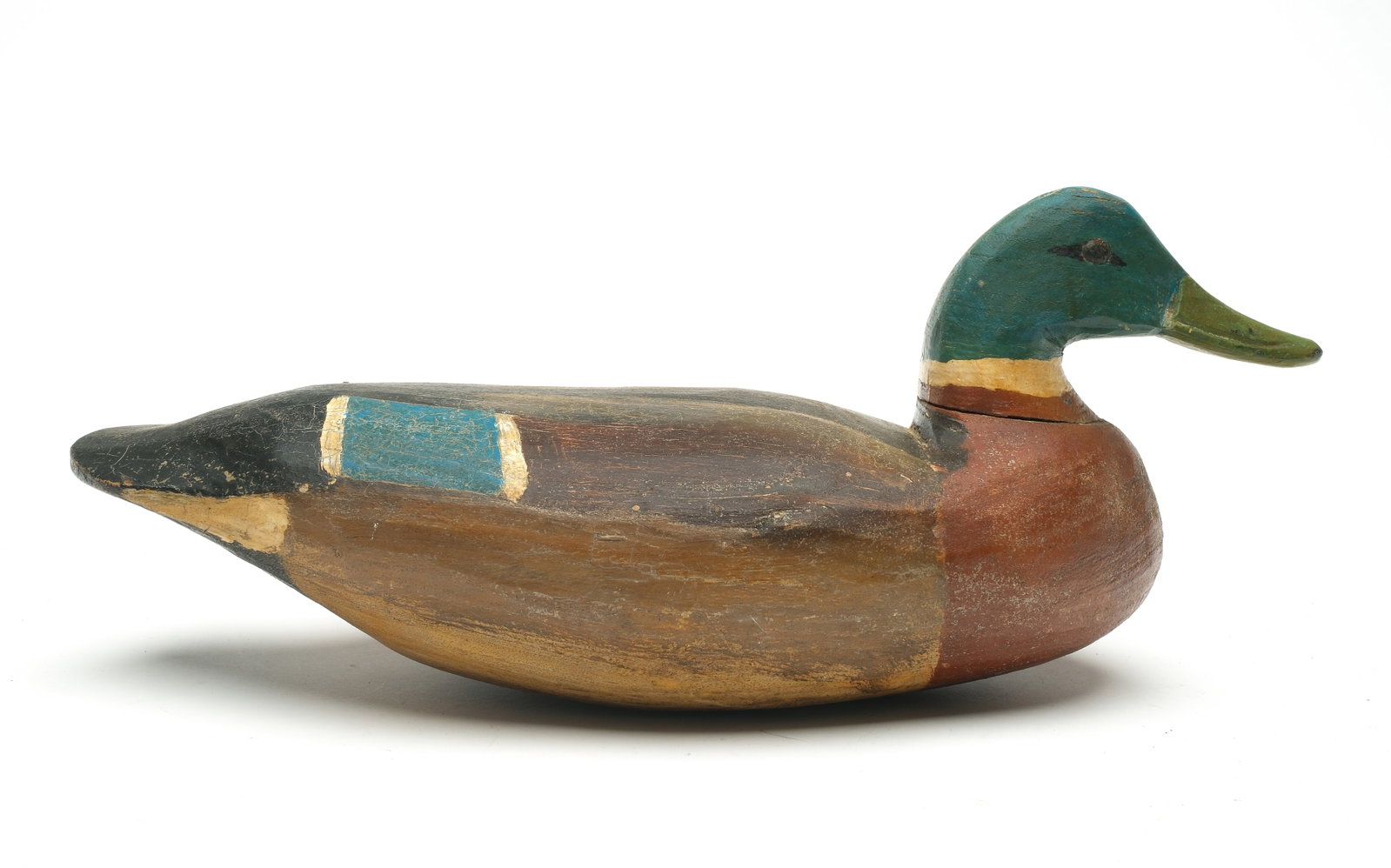 Doug Jester (1876-1961), Chincoteague, Virginia.: Rare mallard. Cotton wood with slightly raised neck seat and tack eyes. Decoy was never rigged or weighted. Measures 17" long. Provenance: Oliver Smith collection.