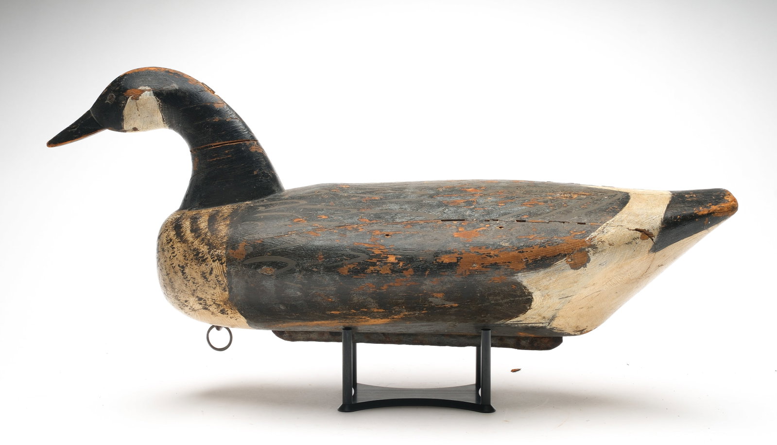Rare Canada goose from Hoopers Island, Maryland, early 20th century.: Slightly swimming head pose. With carved eyes and large iron keel weight. Measures 26" long.