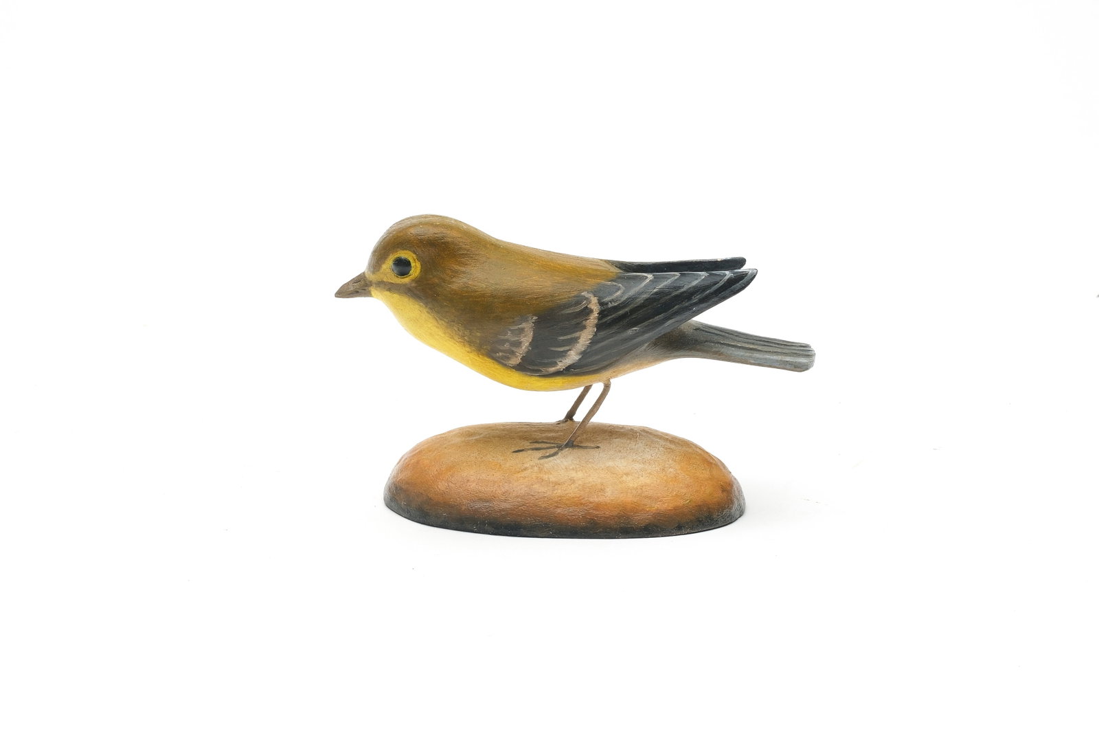 Frank Finney (b.1947), Cape Charles, Virginia.: Yellow throated vireo. Raised, extended wingtips and relief tail feather carving. Identified and with maker's initials carved in underside. Measures 5.25" long.