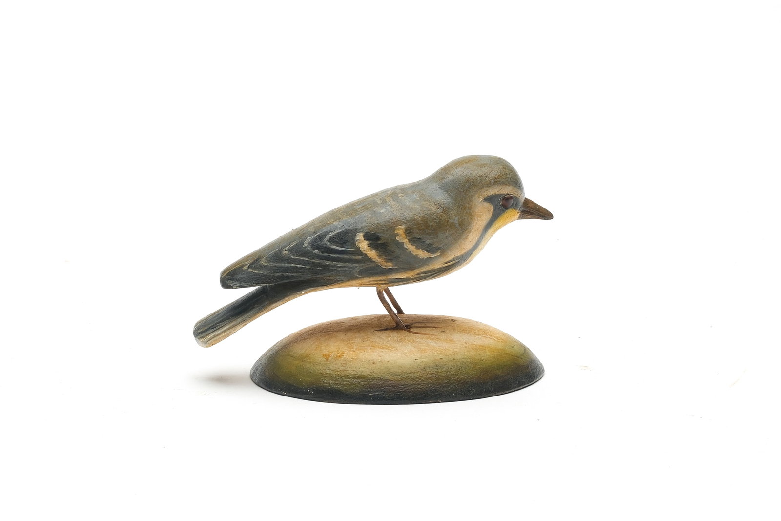 Frank Finney (b.1947), Cape Charles, Virginia.: Yellow throated warbler. Relief tail feather carving. Identified and with maker's initials carved in underside. Measures 4.75" long.