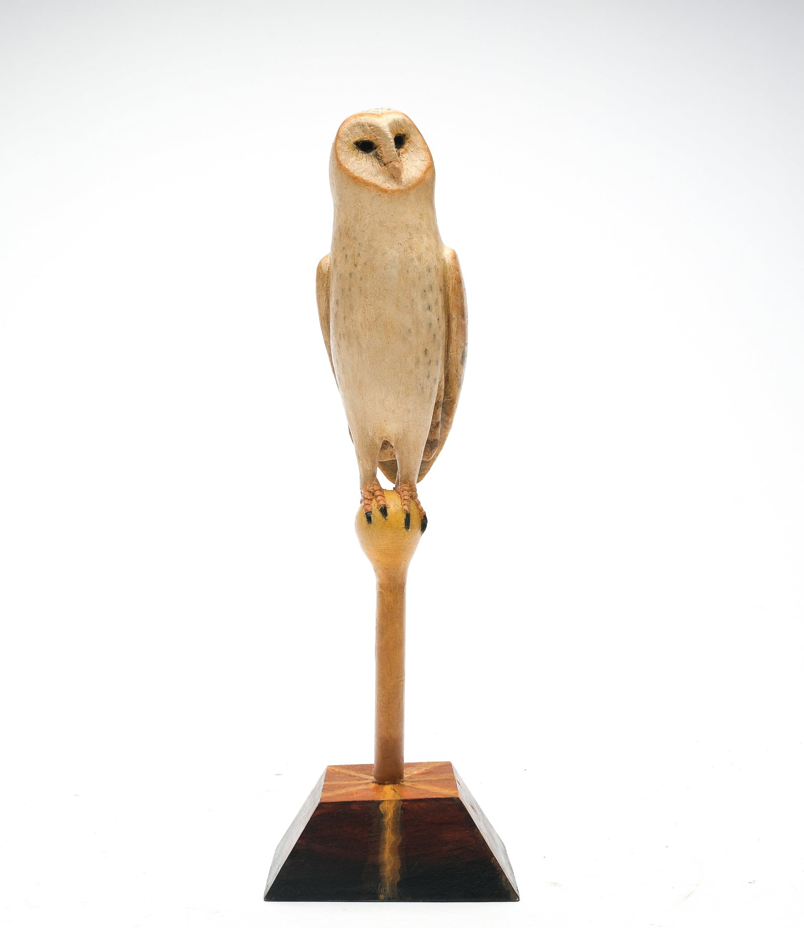 Frank Finney (b.1947), Cape Charles, Virginia.: Miniature owl. Deep relief wing carving and slightly turned head. Maker's ink stamp on underside. Owl measures 6" long, full piece is 11.5" tall with base.