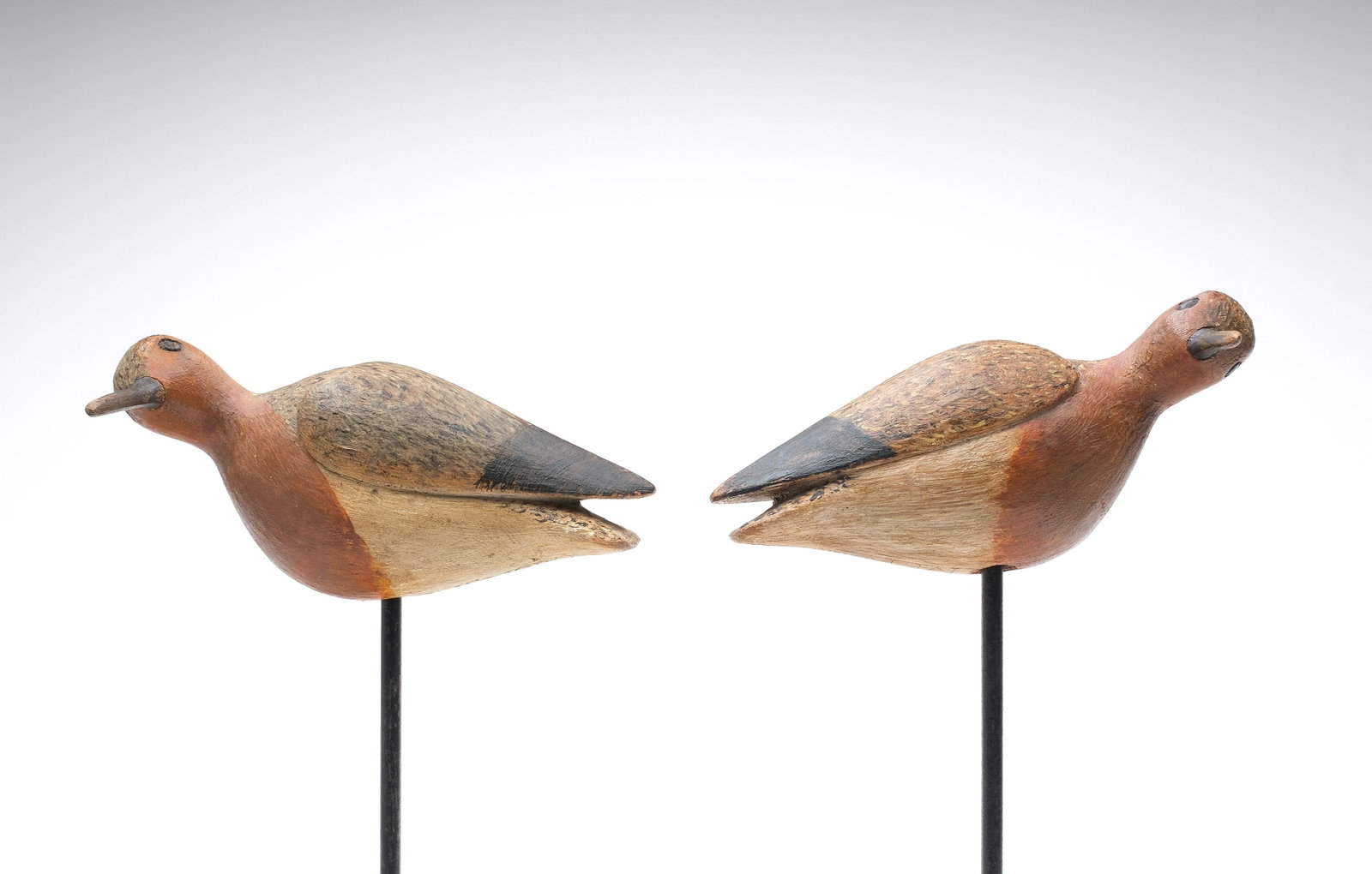 Mark McNair (b.1950), Craddockville, Virginia.: Pair of folky red knots. Plump little birds with deep relief wing carving and heads turned 90 degrees. "McNair" caved in undersides. Measure 6.5" and 7" long.