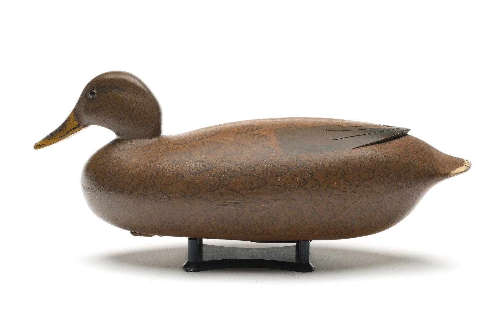 Joe King (1905-1992), Edgely, Pennsylvania.: Mallard hen. Hollow carved with raised V wingtip carving. From the maker's personal rig with name and town stamped in lead weight. Measures 16.5" long. Literature: “The Great Book of Wildfo