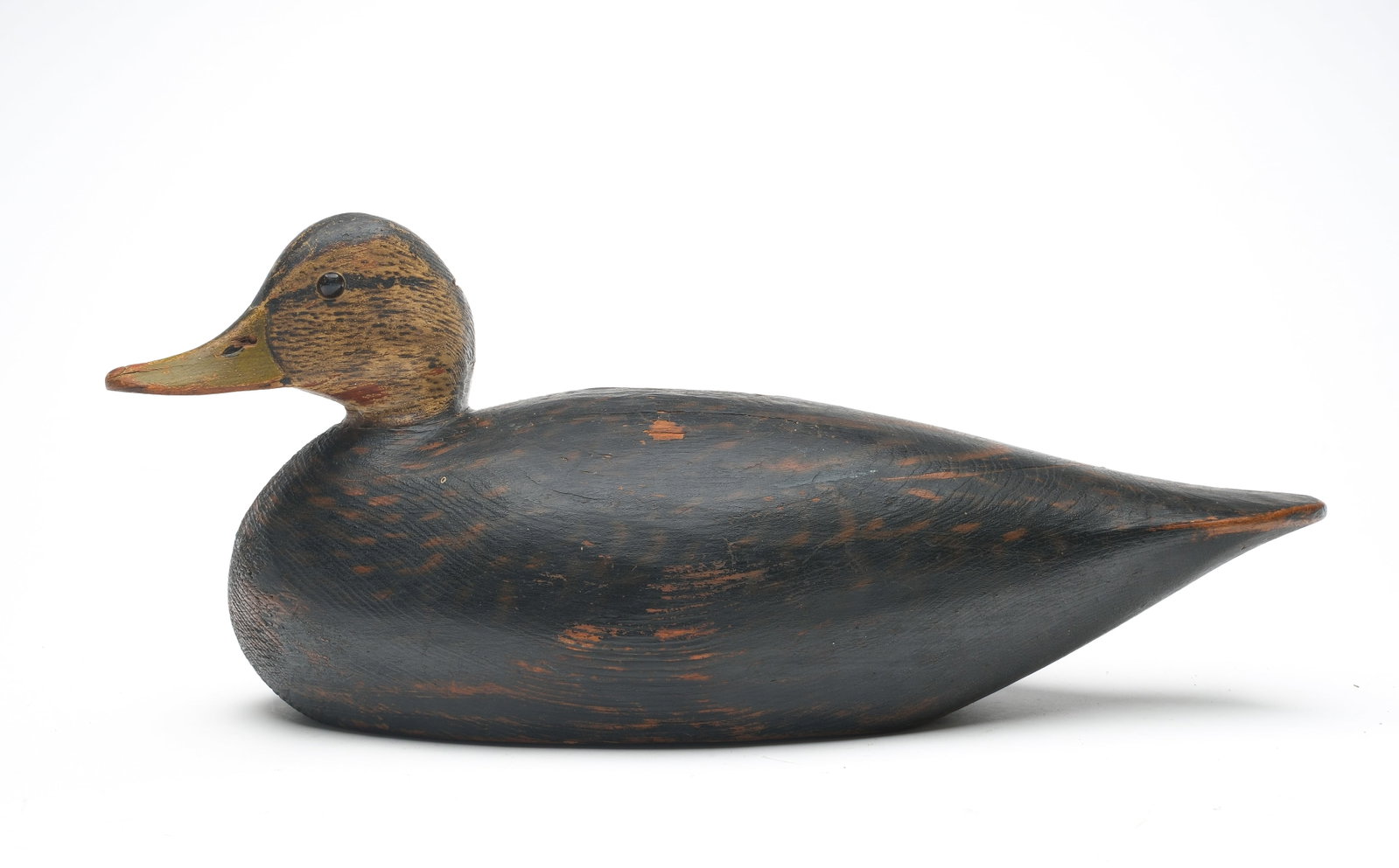 A. Elmer Crowell (1862-1952), East Harwich, Massachusetts.: Large body black duck. Slightly turned head and maker's oval brand on underside. Measures 17" long. Provenance: John Decesare collection.