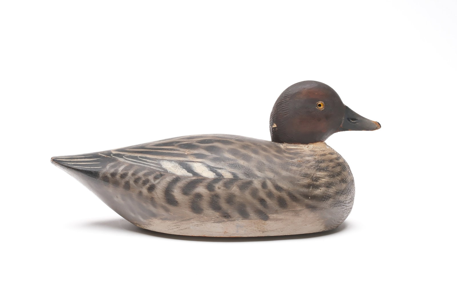 A. Elmer Crowell (1862-1952), East Harwich, Massachusetts.: Low head goldeneye hen. Pre-brand model. "Q" branded in underside for the Quandy collection. Measures 13.5" long. Provenance: Chris Mackey collection.