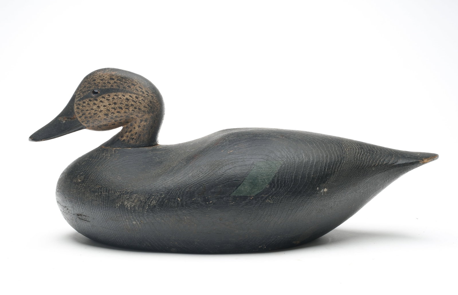 Joseph Lincoln (1859-1938), Accord, Massachusetts.: Classic oversized black duck with reared back head and slight shoulder carving. Mackey collection ink stamp on the underside. Measures 18” long. Provenance: William J. Mackey Jr collection. Ted 