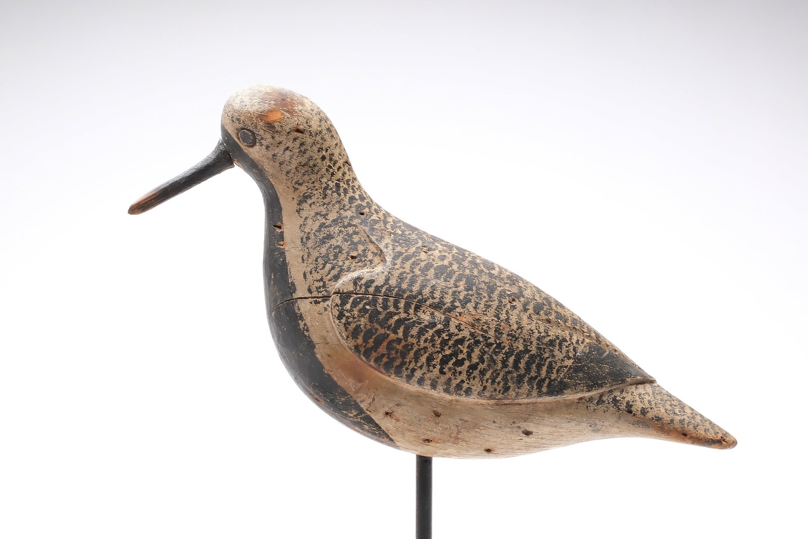 Obediah Verity (1813-1901), Seaford, Long Island, New York.: Plump black bellied plover with deep relief wing carving. Very wide head style with carved eyes on front of head. Measures 9.75" long. Provenance: Mike and Ginger Raffia collection.