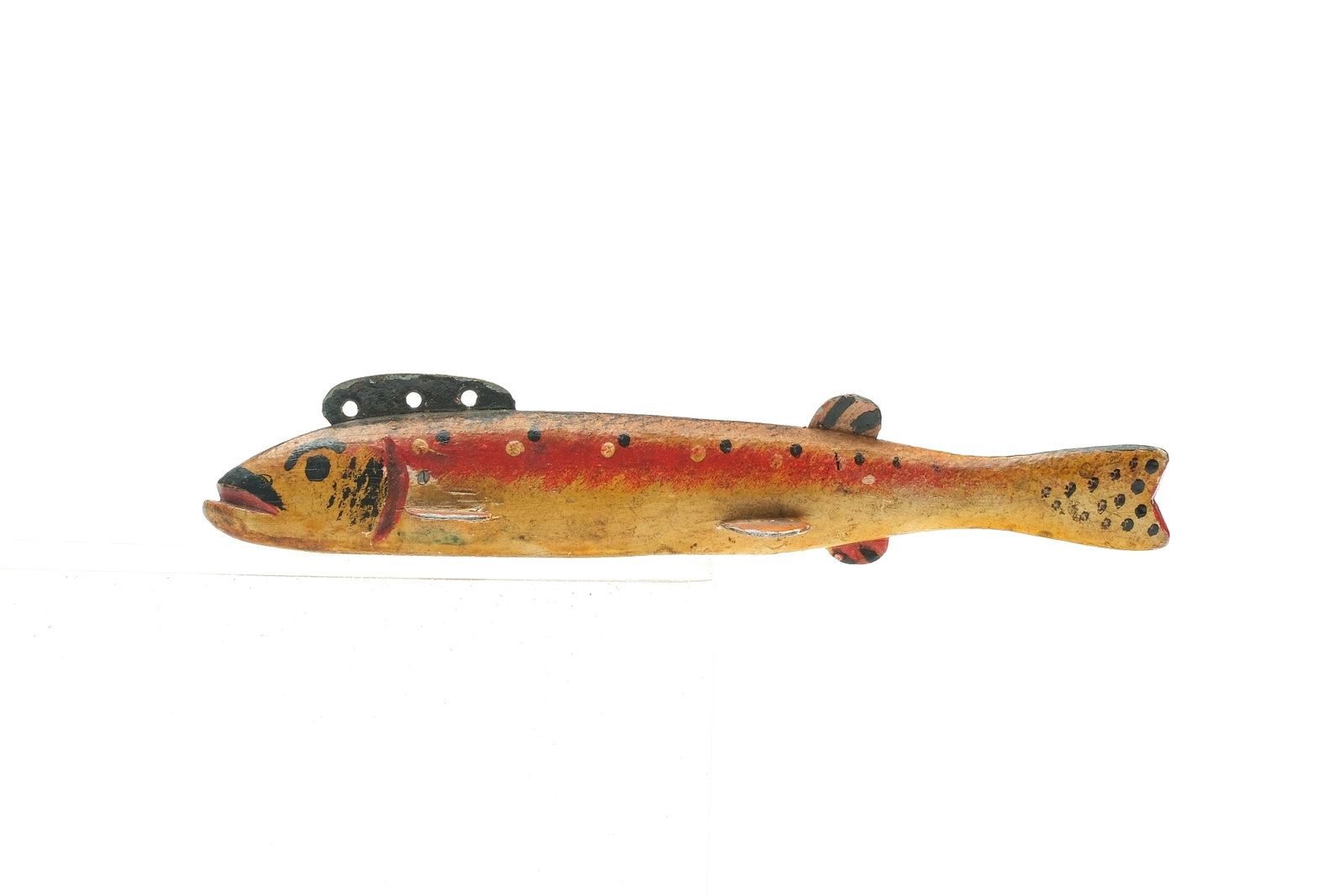 Oscar Peterson (1887-1951), Cadillac, Michigan.: 1st half 20th century. Rainbow trout fish decoy with painted eyes. Measures 5" x 1/2" x 3/4".