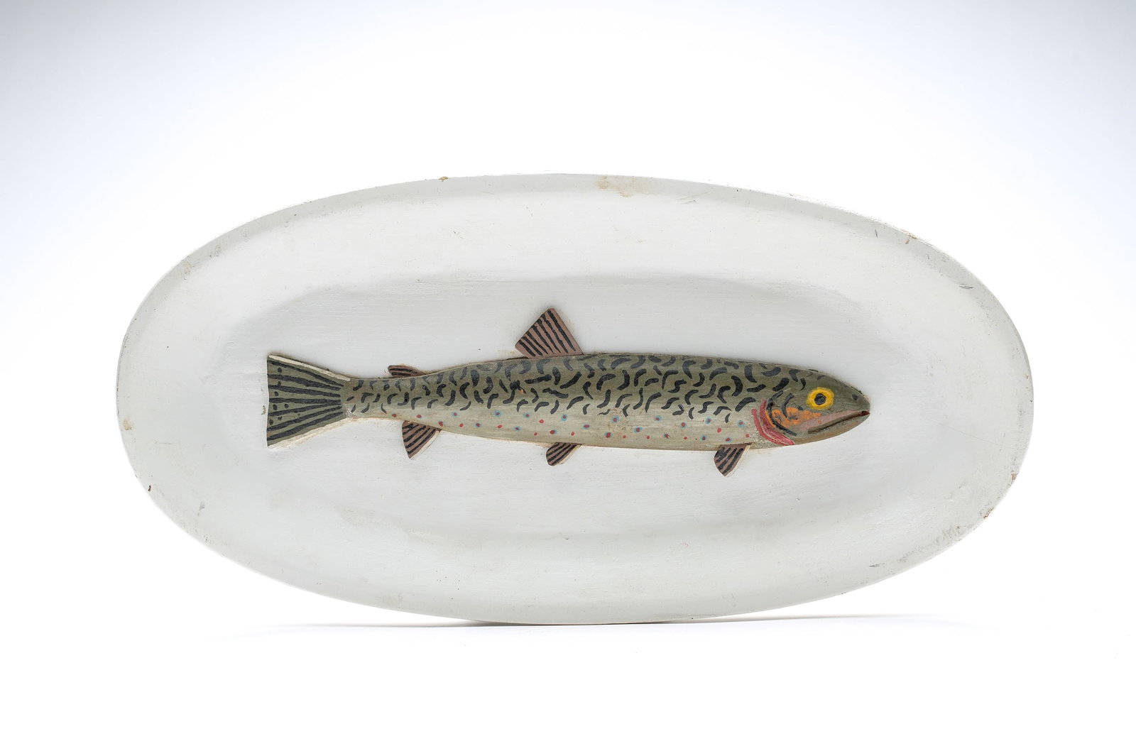 Jess Ramey, Cadillac, Michigan.: Carved fish plaque of a brook trout. Written in pencil, "December 25, 1955. To Floyd and Gloria best wished for a merry Christmas, mom and dad. Made by Jess Ramey." Measures 8.25", plaque is 6.25" x 1