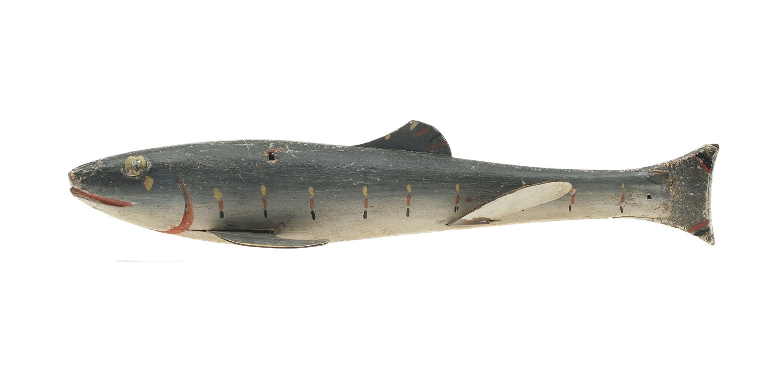 Fish decoy, Lake Chautauqua, New York, 3rd quarter 19th century.: Tack eyes with carved gill, mouth, line tie drilled through back. Leather tail. Measures 7.25" long.