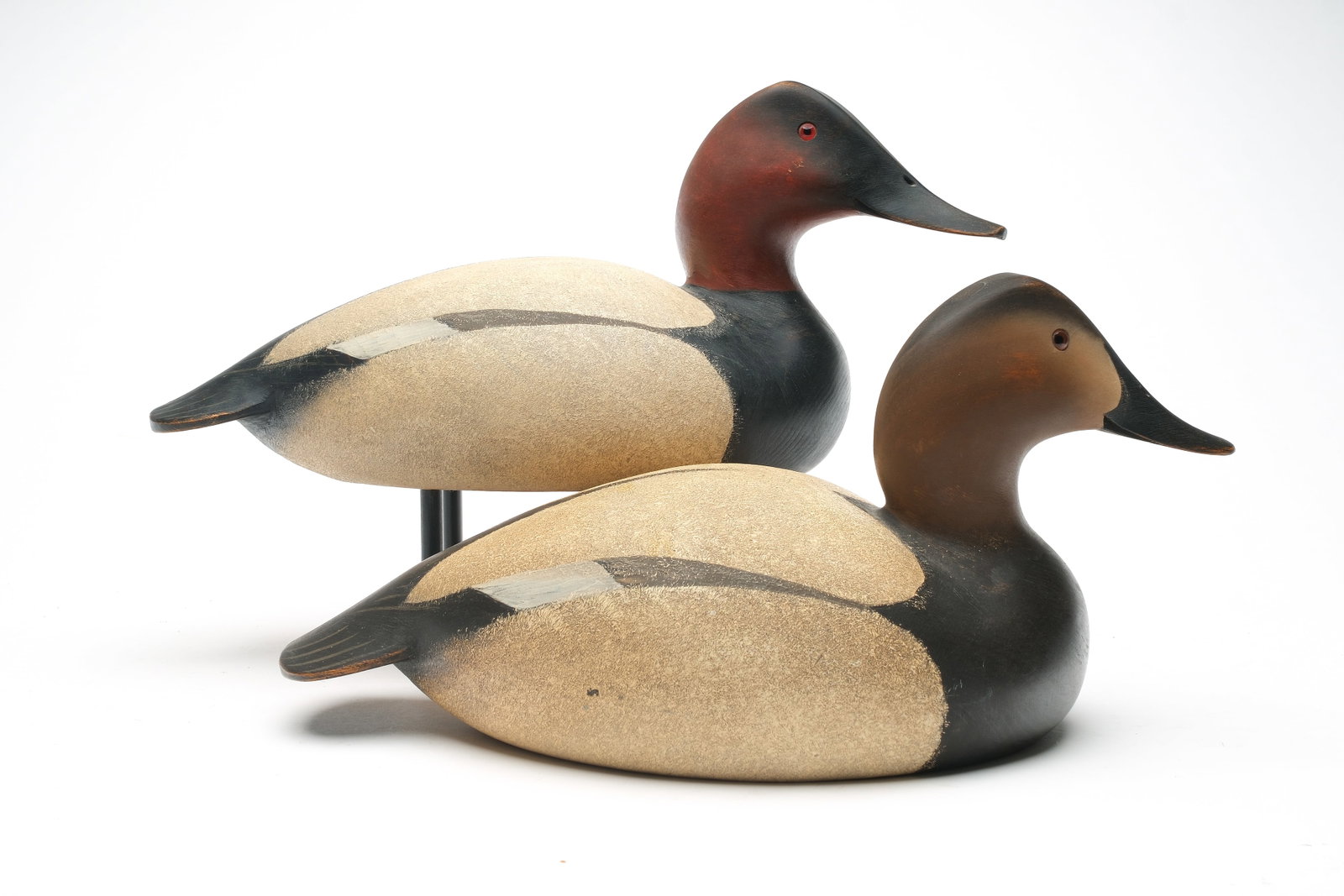 Oliver Lawson (b.1938), Crisfield, Maryland.: Pair of canvasbacks with turned heads and great stipple painting. Signed and dated 1985 with "L" carved in underside. Drake measures 15". Provenance: Fredrick Raymond Collection.