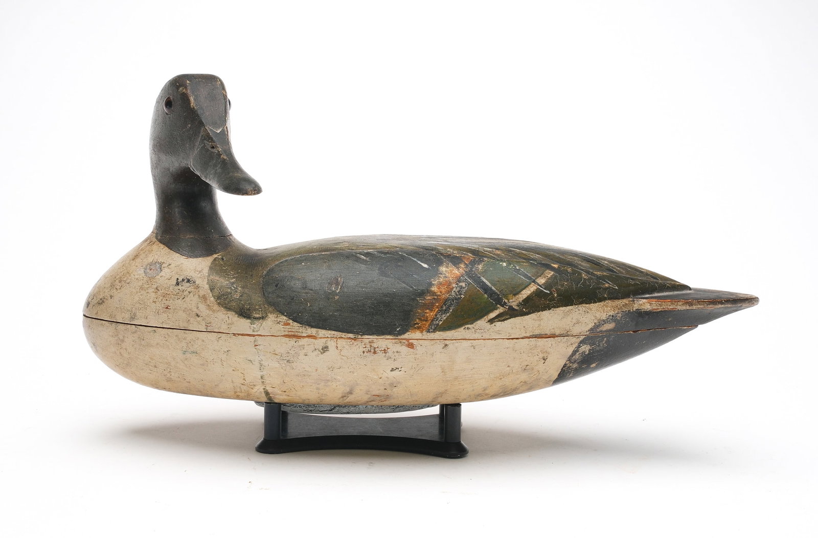 Very rare pintail from the Carriage House rig, Lacon, Illinois, circa 1890.: Hollow carved with turned head and relief wing carving. Measure 15.5" long. Provenance: Don Leonard collection.