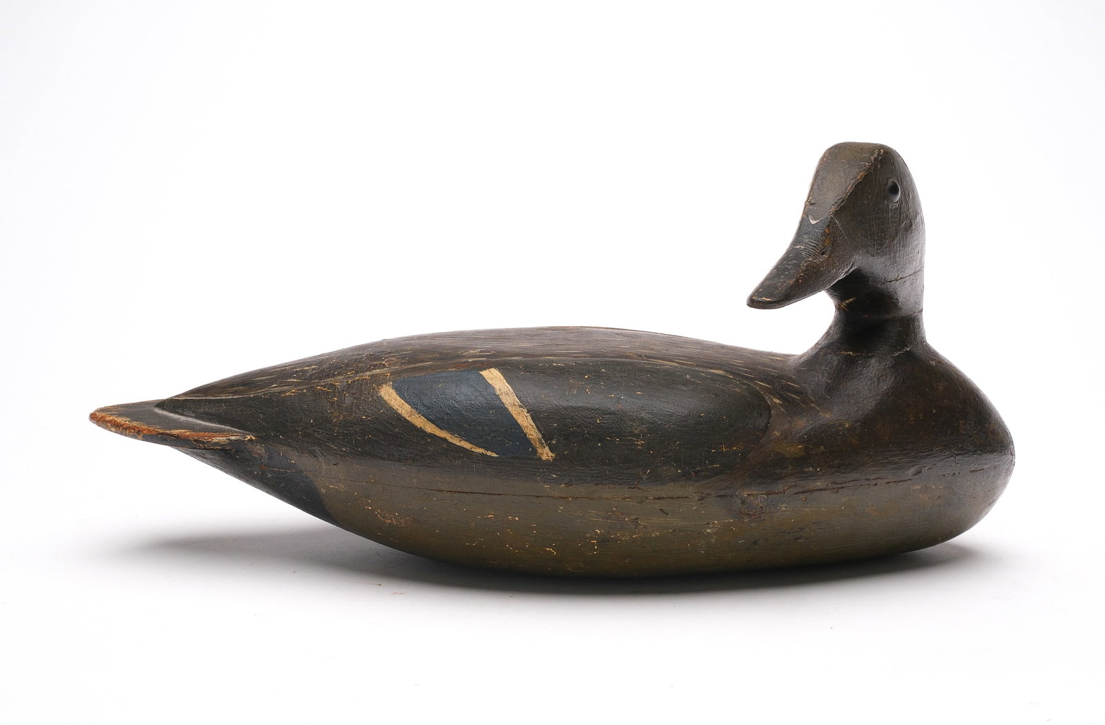 Very rare mallard hen from the Carriage House rig, Lacon, Illinois, circa 1890.: Hollow carved with turned head and relief wing carving. Measure 15.5" long. Provenance: Don Leonard collection.