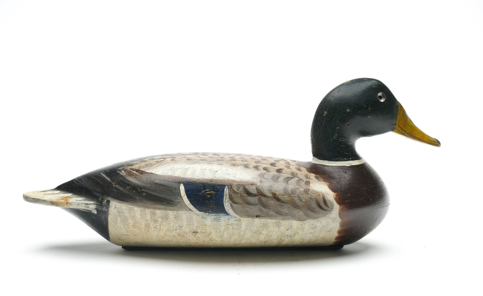 Robert Elliston (1849-1915), Bureau, Illinois.: Mallard. Hollow carved comb feather paint detail. "W.H. Dupee" branded in underside. Retains the original Elliston weight. Measures 16.5" long. Provenance: John Decesare collection.