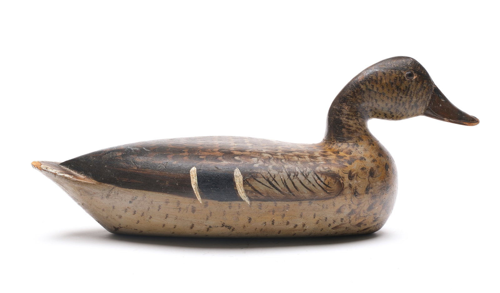 Bert Graves (1880-1956), Peoria, Illinois.: Rare swimming mallard hen. Hollow carved with slightly forward head pose. Measures 17" long.