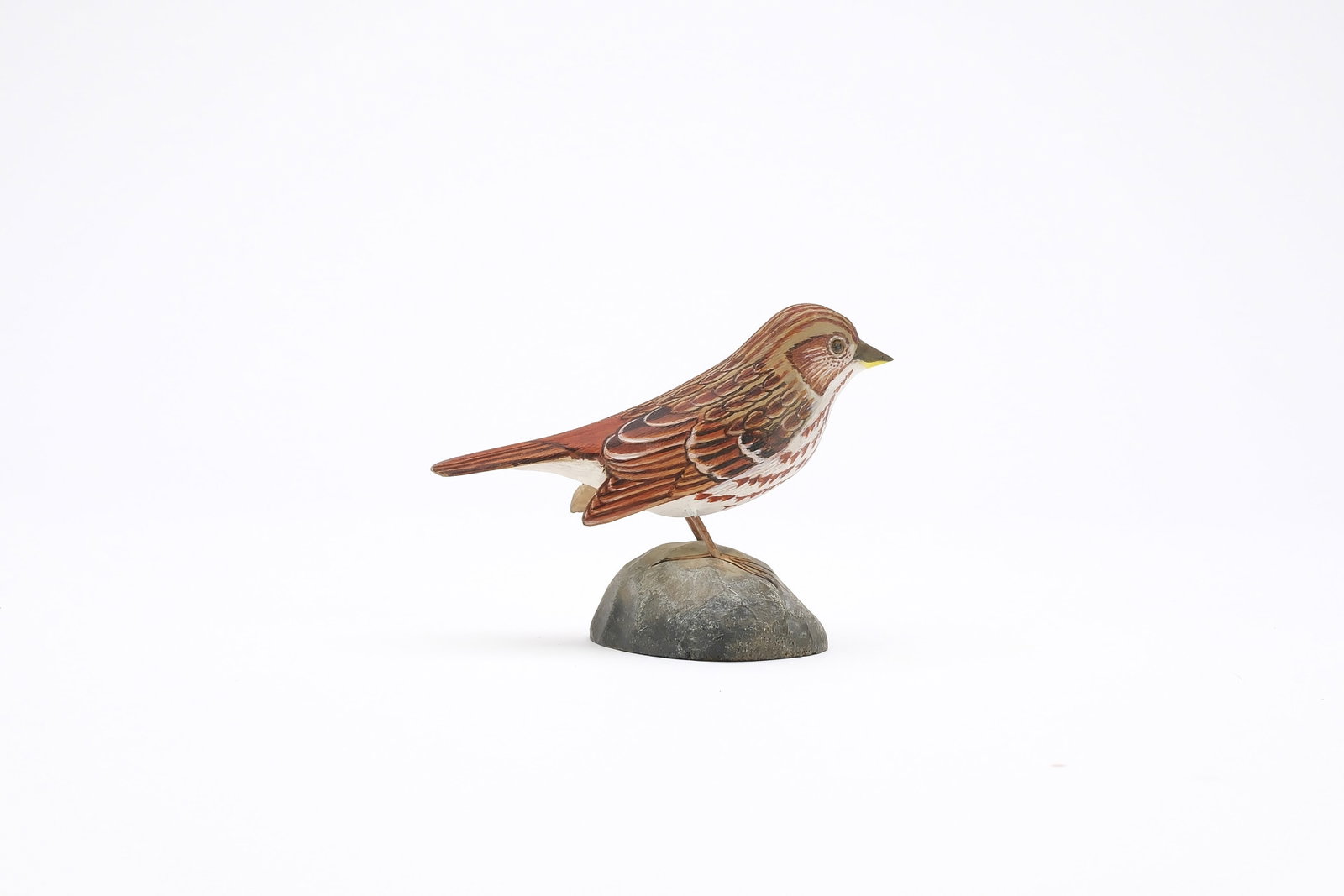 Jess Blackstone (1909-1988), Concord, New Hampshire.: Miniature fox sparrow. Dropped wing carving and feather rasping. Identified, initialed, and numbered 40 on underside. Measures 3.75" long. Provenance: Joseph Ellis collection.