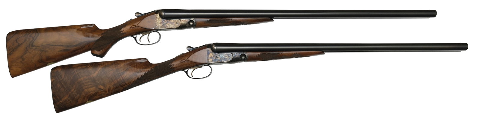 EXTRAORDINARILY RARE PARKER REPRODUCTIONS PROTOTYPE 12 BORE SHOTGUNS WITH CASES.: Gun 1- SN. PRO 12-02. Cal. 12ga. Built with 28" brls that have matted concave top rib with small brass front bead. Left brl stamped "PARKER REPRODUCTION BY WINCHESTER - 12 GAUGE- 2 3/4" & 3" / EAST AL