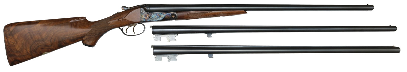 AS NEW AND VERY RARE PARKER REPRODUCTIONS DHE THREE BARREL SET 20 AND 16 BORE WITH CASE.: SN. 20-04377. Cal. 20ga, 20ga, & 16ga. Built with three sets of brls that have matted concave top ribs with small brass front beads, usual rib legends, and markings. Brl flats with choke stamps o