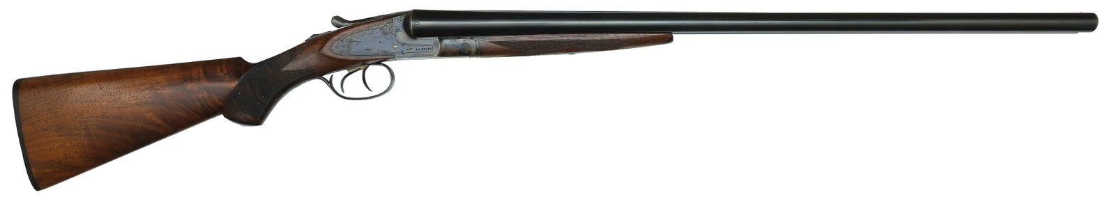 EXCEPTIONAL NEAR MINT L.C. SMITH TRAP GRADE 12 BORE SHOTGUN WITH ORIGINAL HANG TAG AND BOX.: SN. FWE107288. Cal. 12ga. Built with 28" steel brls that have matted concave top rib with small brass front bead. Top of brls with usual maker's stamps. Brl flats with SN and stamped "T". Point patter