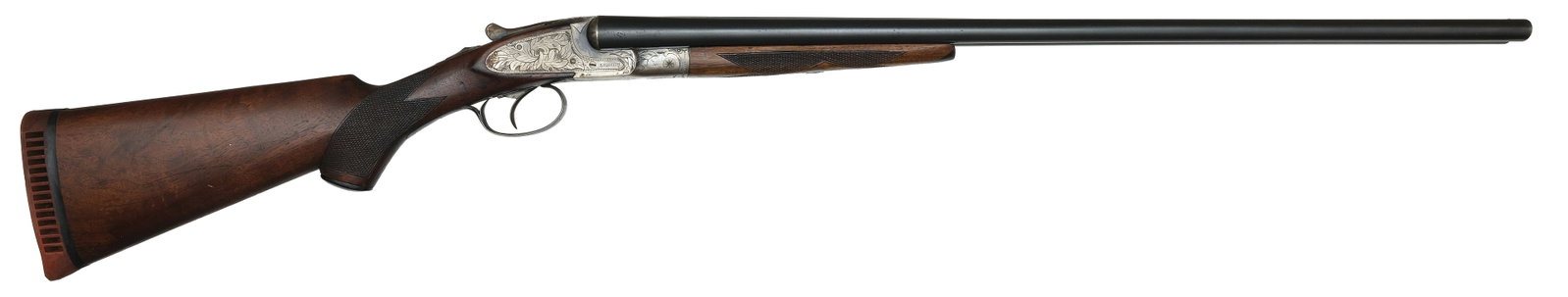 SCARCE L.C. SMITH IDEAL GRADE 20 BORE SHOTGUN.: SN. FWE14789. Cal. 20ga. Built with 28" brls that have matted concave top rib with brass front bead. Tops of brls with usual maker's stamps. Walnut splinter forend with triangular ebony tip, is point 
