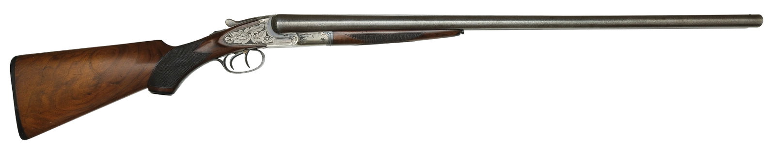 SCARCE TRANSITIONAL L.C. SMITH IDEAL GRADE 12 BORE SHOTGUN.: SN. Cal. Built with 30" damascus brls that have matted concave top rib with small brass front bead. Tops of brls with usual maker's stamps. Rare Curtis style push button forend opener on spl