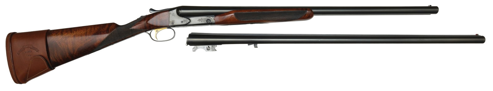 BEAUTIFUL CUSTOM ENGRAVED WINCHESTER MODEL 21-2 TWO BARREL SET WITH CASE.: SN. 21404. Cal. 12ga. Set 1-30" set 2-26" Gun built with 30" brls that have matted concave top rib with red Bradley front bead. Brl flats are engine turned and stamped with SN. Bottoms of tubes with "