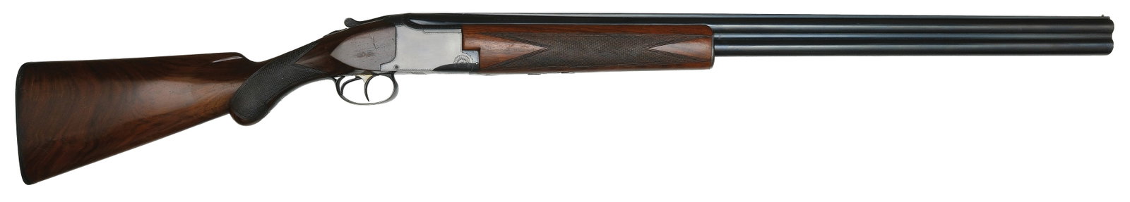 RARE EXTREMELY EARLY PRODUCTION 12 BORE BROWNING SUPERPOSED.: SN. 1445. Cal. 12ga. Built with 30" solid matted rib brls that have small brass front bead. Let side of brl lump with "**" (Mod.) and "*" (Full) choke stamps. First style walnut forend is point patter