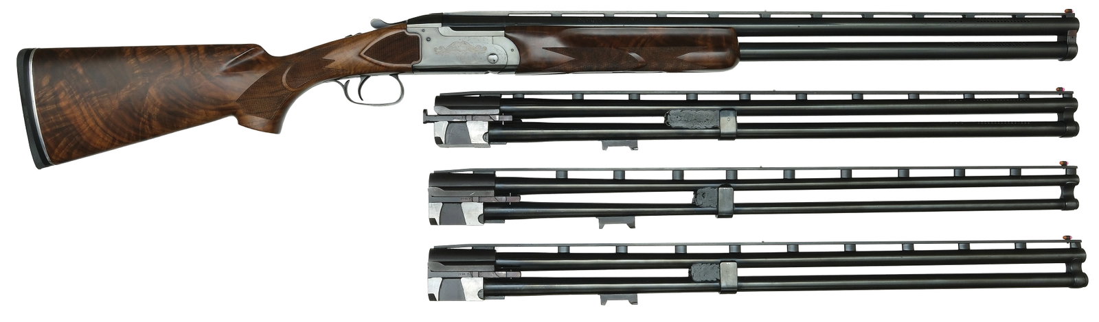USEFUL REMINGTON MODEL 3200 COMPETITION FOUR BARREL SKEET SET.: SN. OU44191. Cal. 12ga, 20ga, 28ga & .410ga. Set 1 is 27-3/4" with slightly raised matted ventilated top rib with white mid and fluorescent front beads. Brl set is ported. Set 2 same as 1 wi