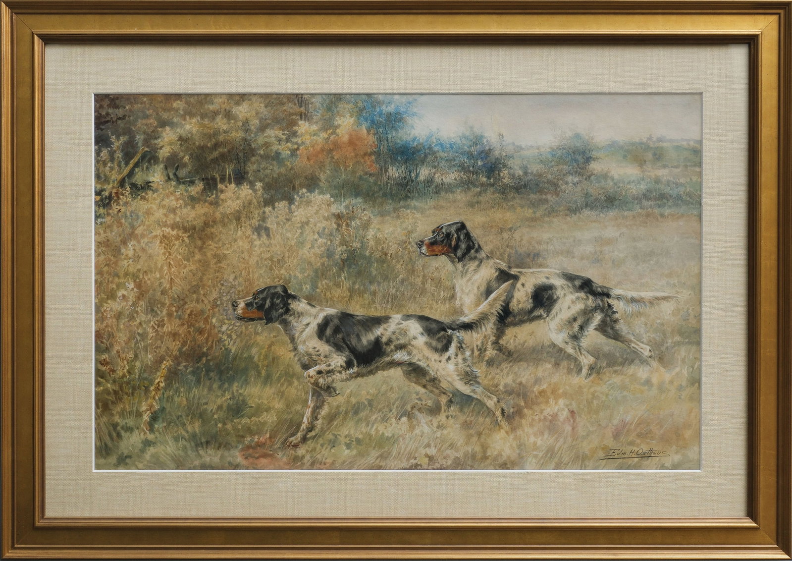 Edmund Osthaus (1858-1928), watercolor on paper.: Signed lower right. 18 x 29 in. (image). 27 x 37 ¾ in. (frame). Osthaus has painted the moment these Brace Mates have locked on the scent of their quarry. The lead Lewellyn is abou