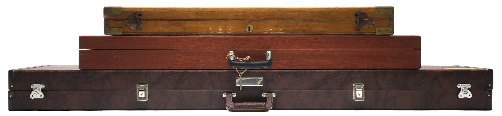 THREE BIG BORE GUN CASES.: This lot consists of three gun cases. Case 1- oak & brass bound case for a James Purdey hammer shotgun. Will fit 30" brls. Case with plush canvas cover and unengraved brass oval on top Case 2- Modern