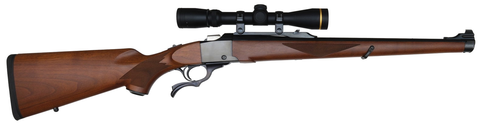 EXCELLENT RUGER NO. 1 CARBINE WITH MANNLICHER STOCK IN .257 ROBERTS CALIBER.: SN. 134-39520. Cal. .257 Roberts. Built with 20" blued round brl that has quarter rear rib with flip up sight and ramp blade front sight. Full length stock with triangle checkering on sides. Blue