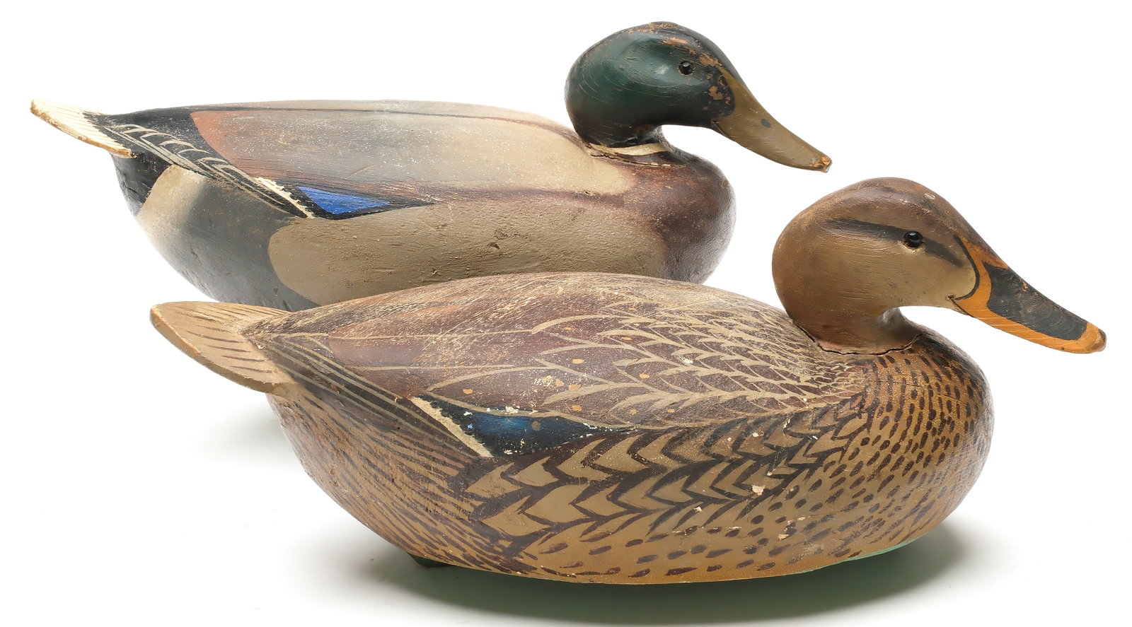 Ward Brothers, Crisfield, Maryland.: Rigmate pair of mallards. 1948 balsa body style, with slightly turned heads and applied cedar tails. Signed and dated 1948 on undersides. Measure 16.75" long. PROVENANCE: Oliver Smith collection.