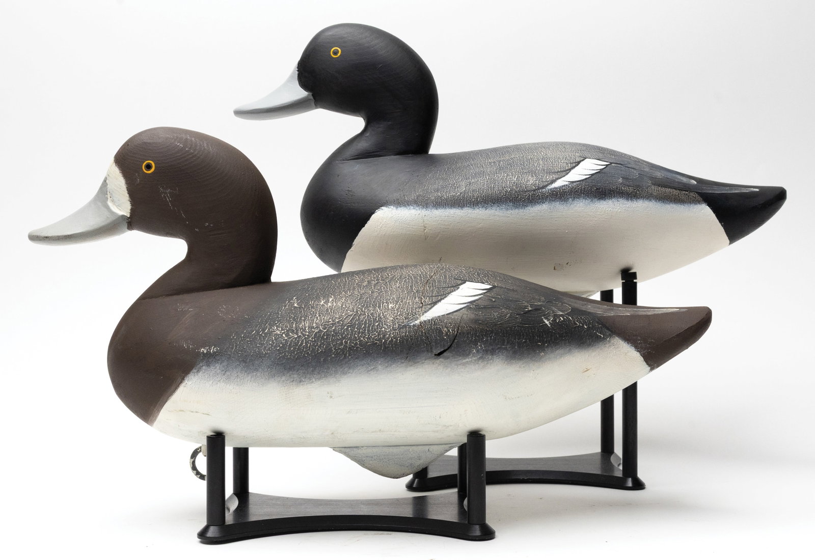 Charlie Joiner (1921-2015), Chestertown, Maryland.: Pair of bluebills. Both with fine stipple paint on backs and defined wing patches. Number "2" branded on the underside of hen. Measure 14.75" long.