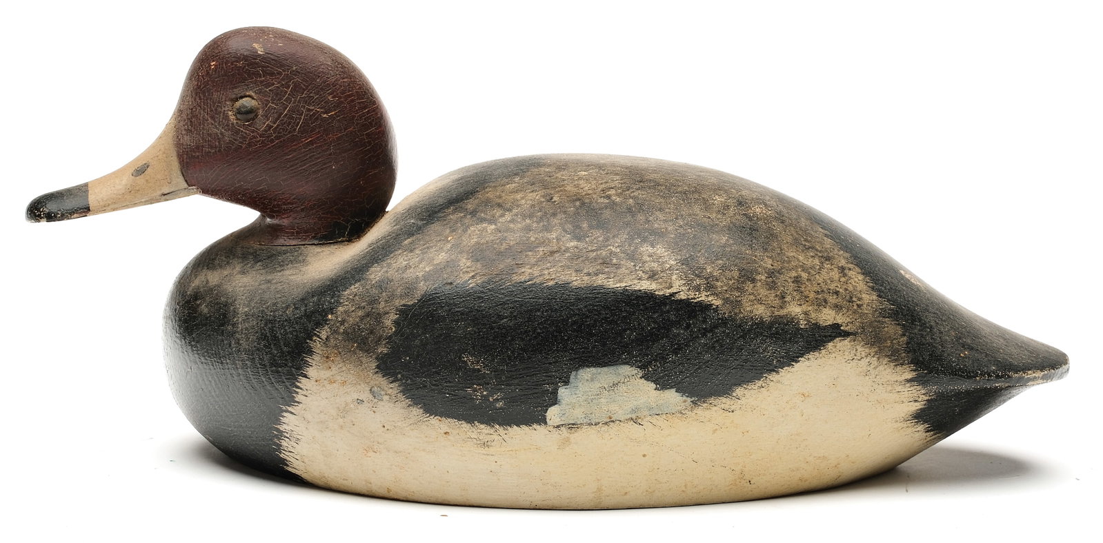 Keyes Chadwick (1865-1958), Oaks Bluff, Massachusetts.: Redhead. Slightly turned head and round inlaid lead weight in underside. Measures 14" long. PROVENANCE: Don Leonard collection.